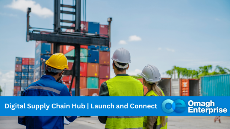 The backs of 3 people in high-vis jackets and hard hats. They are watching cradles being loaded onto a transport ship on a dock. Blue banner along the bottom. White text " Digital Supply Chain Hub | Launch and Connect" Omagh Enterprise logo within the blue banner